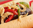 Grilled Brats with Peppers & Crispy Onions